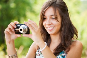 a woman holding a camera